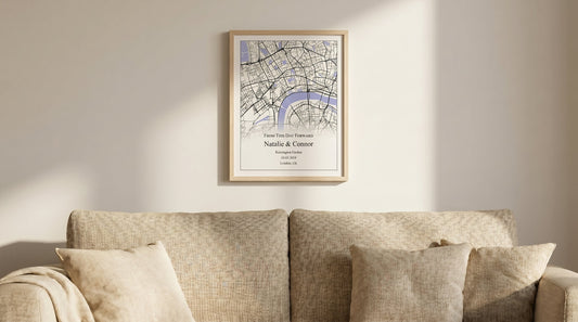 Room scene of light cloth sofa with an engagement map print hanging on the wall above